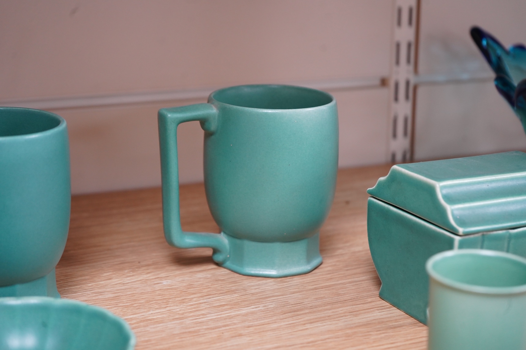 Keith Murray for Wedgwood, three green mugs, cigarette box, fluted dish and small vase, largest 12cm high (6)